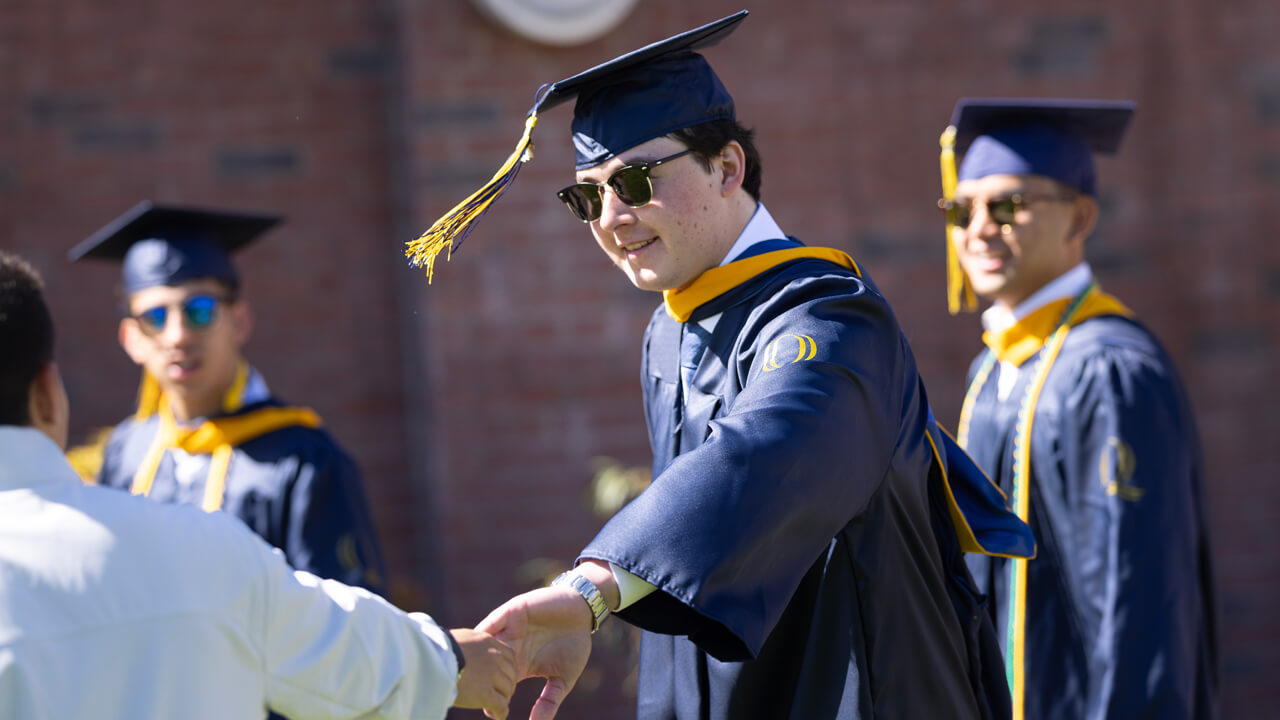 Students holds hands with individual