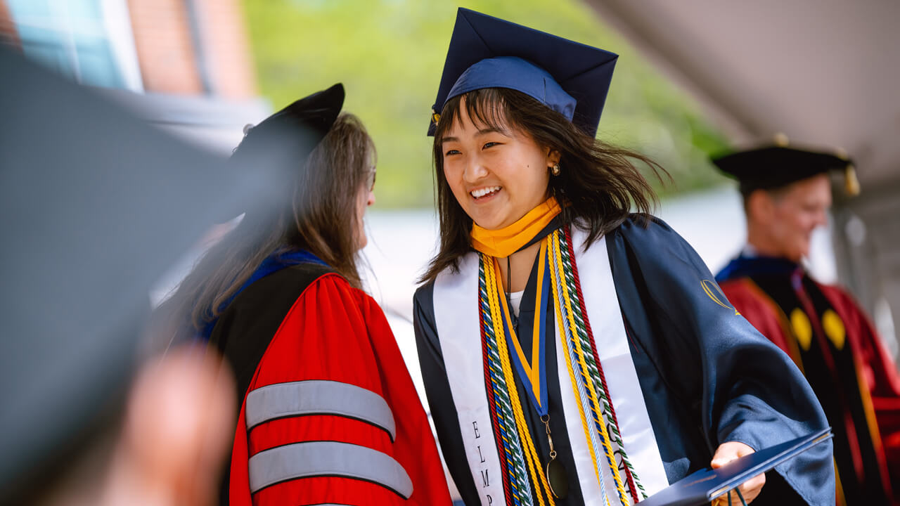 Student walks across the stage