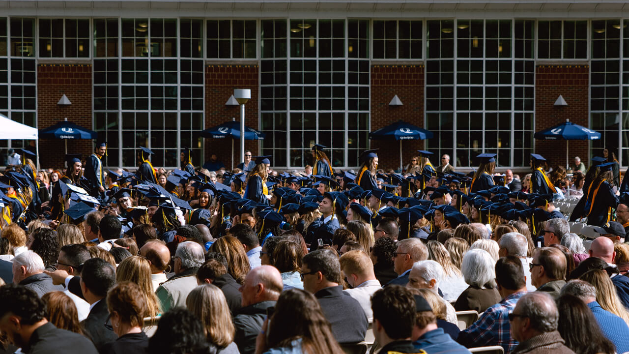 Students walk through the crowd