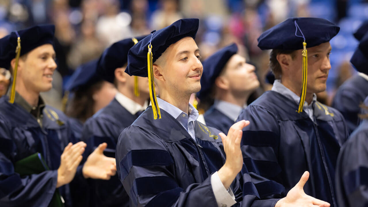 Crowd of School of Medicine students clapping