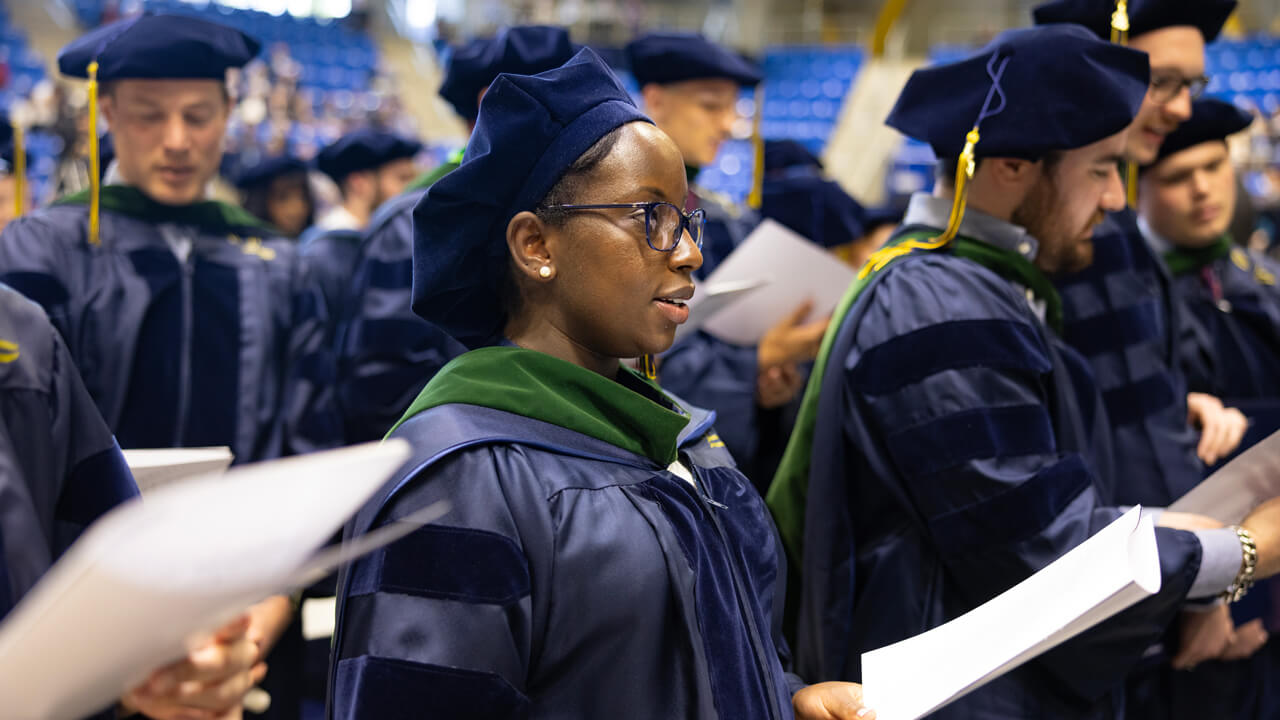 Graduates read aloud from papers with the Hippocratic Oath