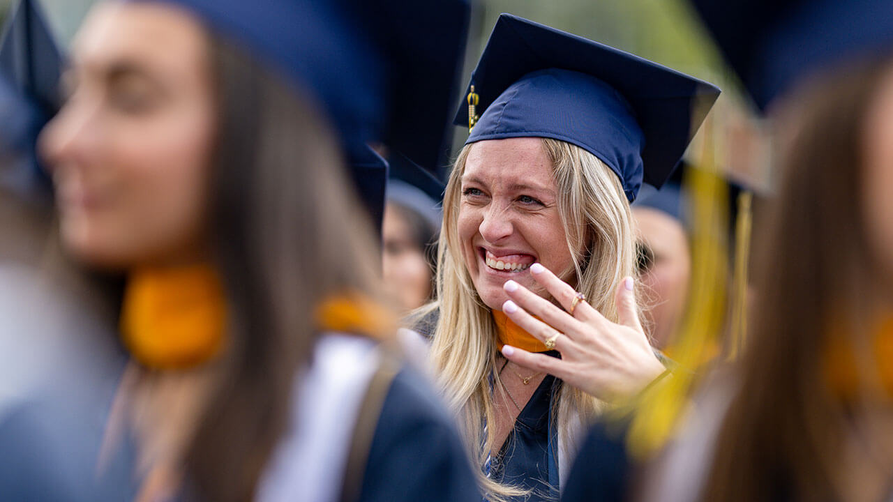 graduate waves off tears