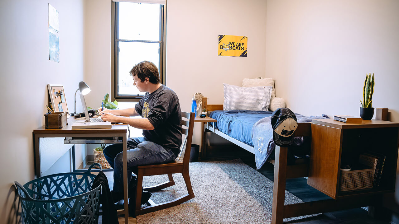 Student works at desk