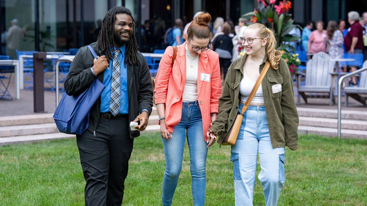 Students walk out of the School of Law