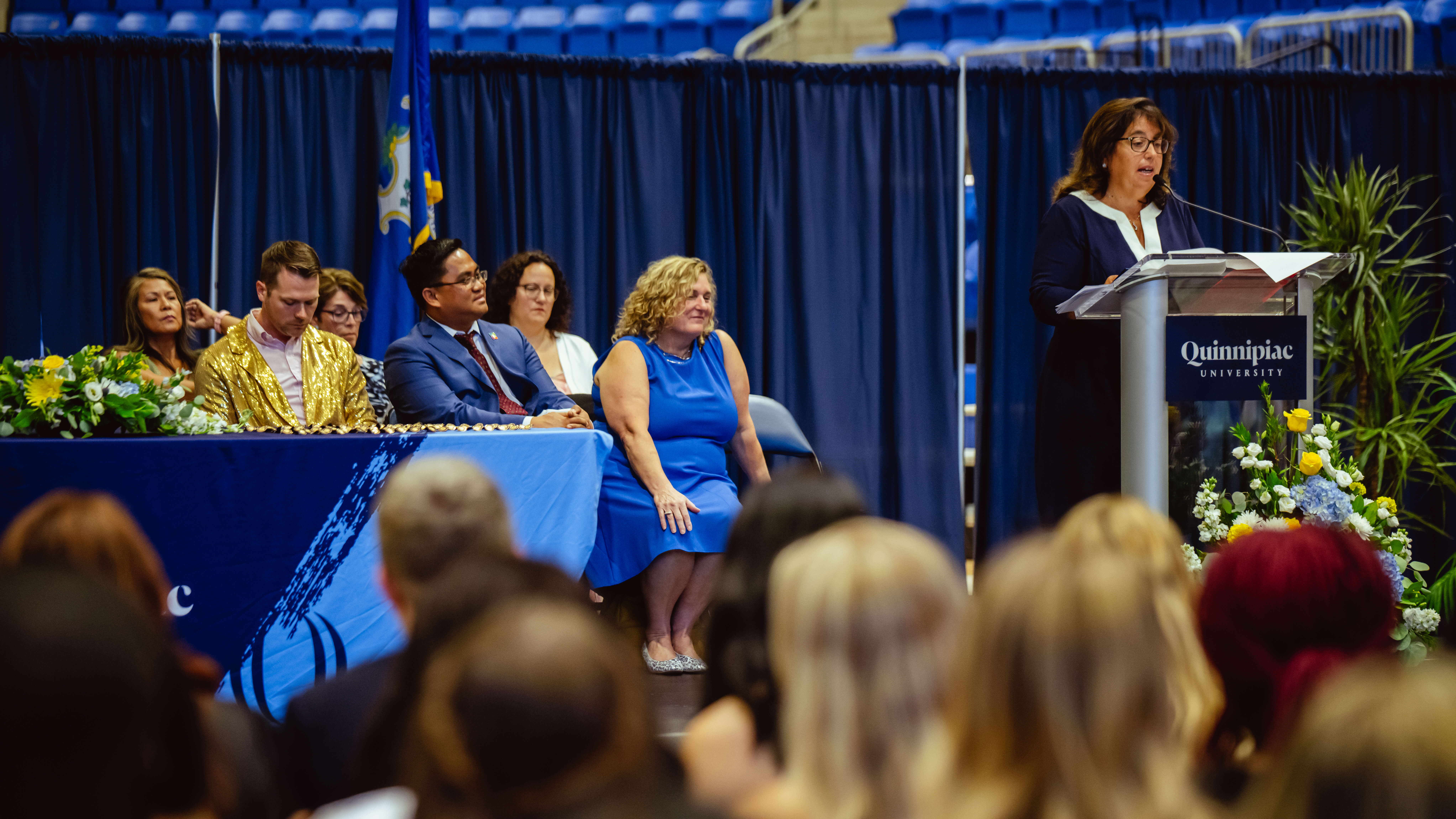 A speaker address all of the recent graduates