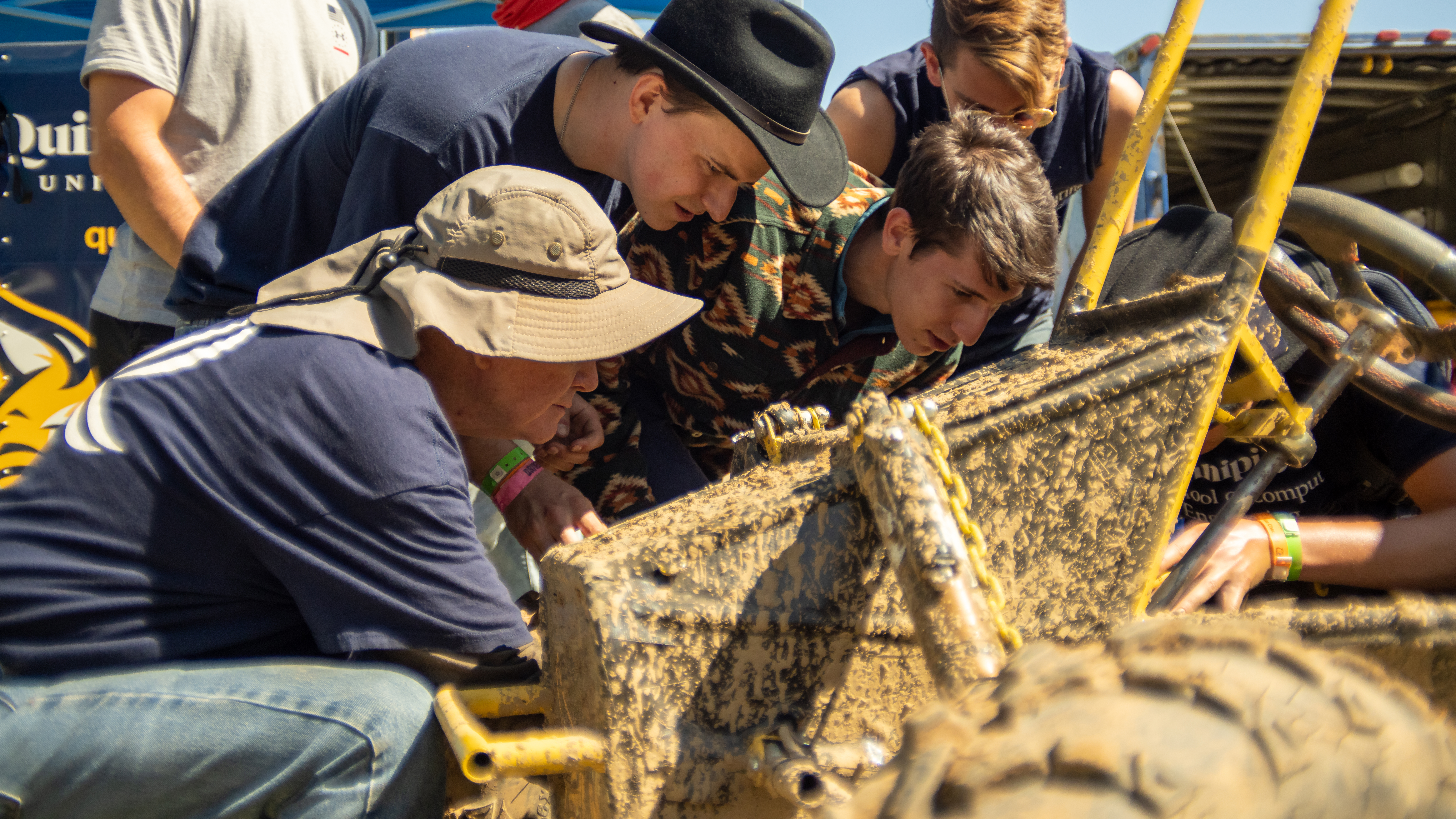 Students examine a vehicle