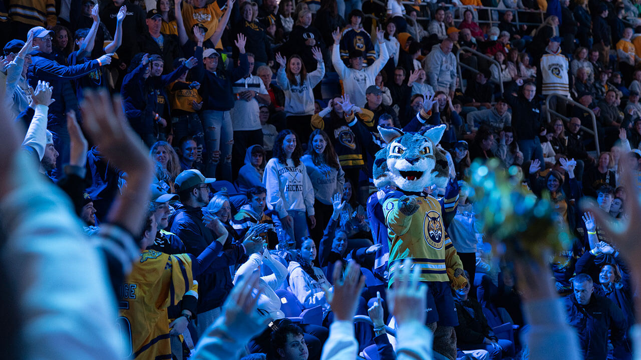 Boomer hypes up the crowd in the arena