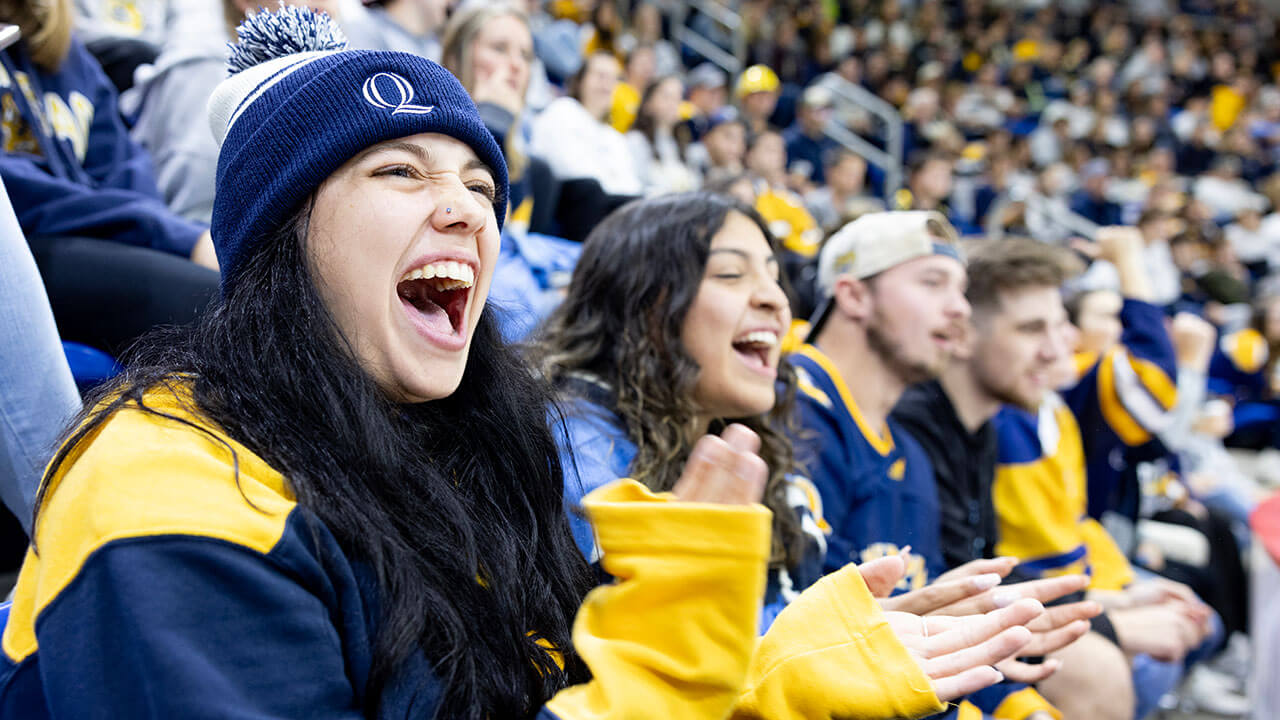 Fans cheer for the Quinnipiac men's ice hockey team