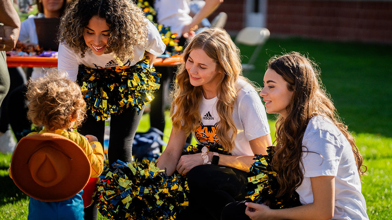 Ice cats cheerfully talking with an event goer