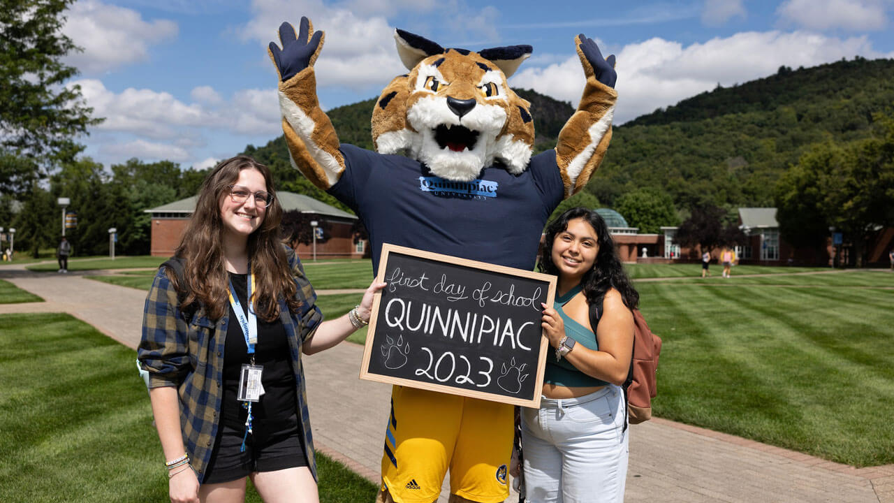 Boomer shows his excitement with students on the first day of classes