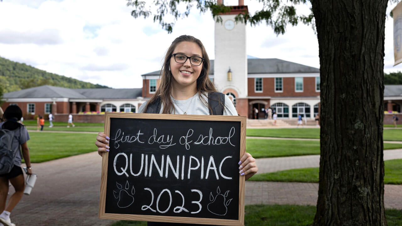 A student shows excitement for her first day of school