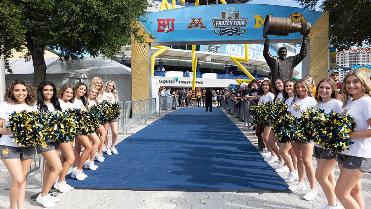 ice cats line the blue carpet leading towards Amalie Arena