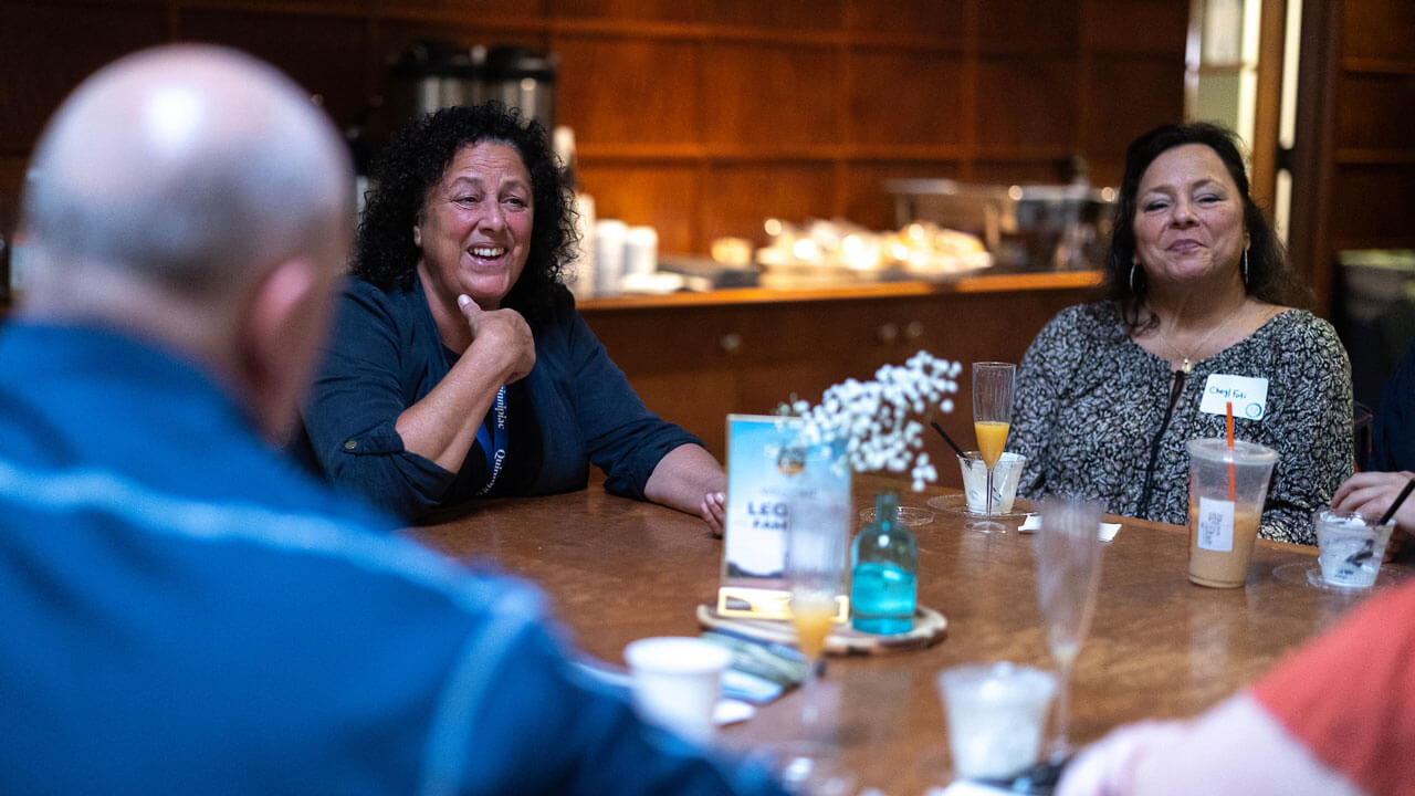 Parents laughing together at lunch table