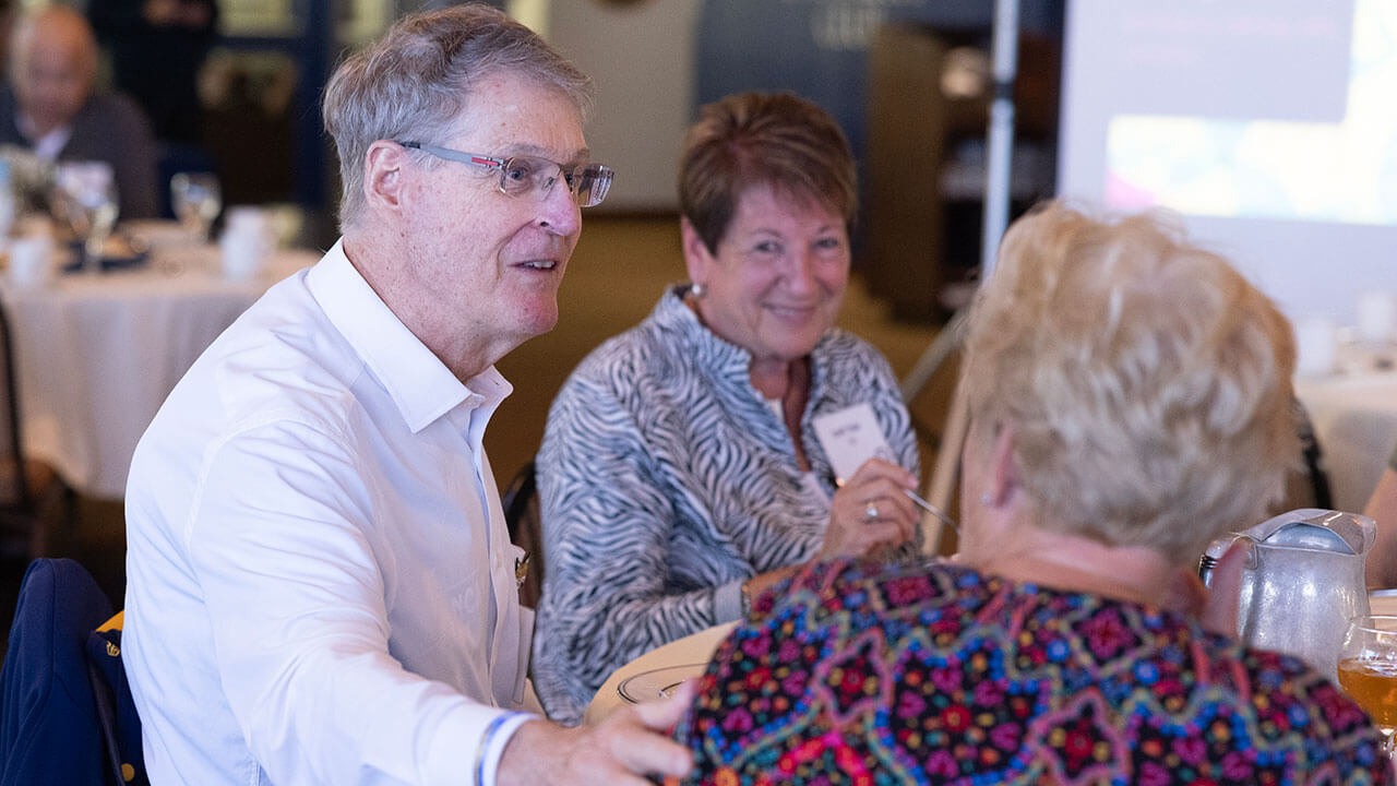 Alumni talking to each other at the Heritage Luncheon