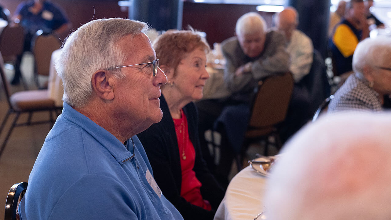 Alumni listening to a speaker at the Heritage Luncheon