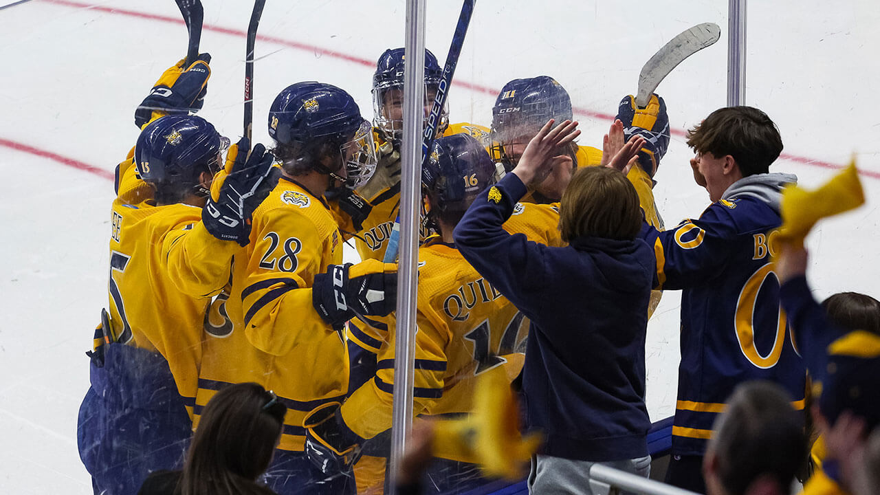 Men's Ice Hockey celebrates with excited fans