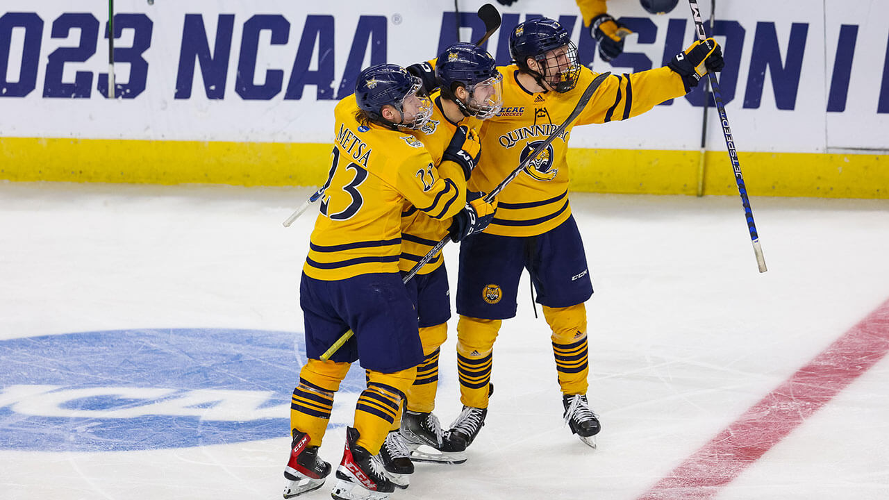 Men's Ice Hockey celebrate another goal against Merrimack