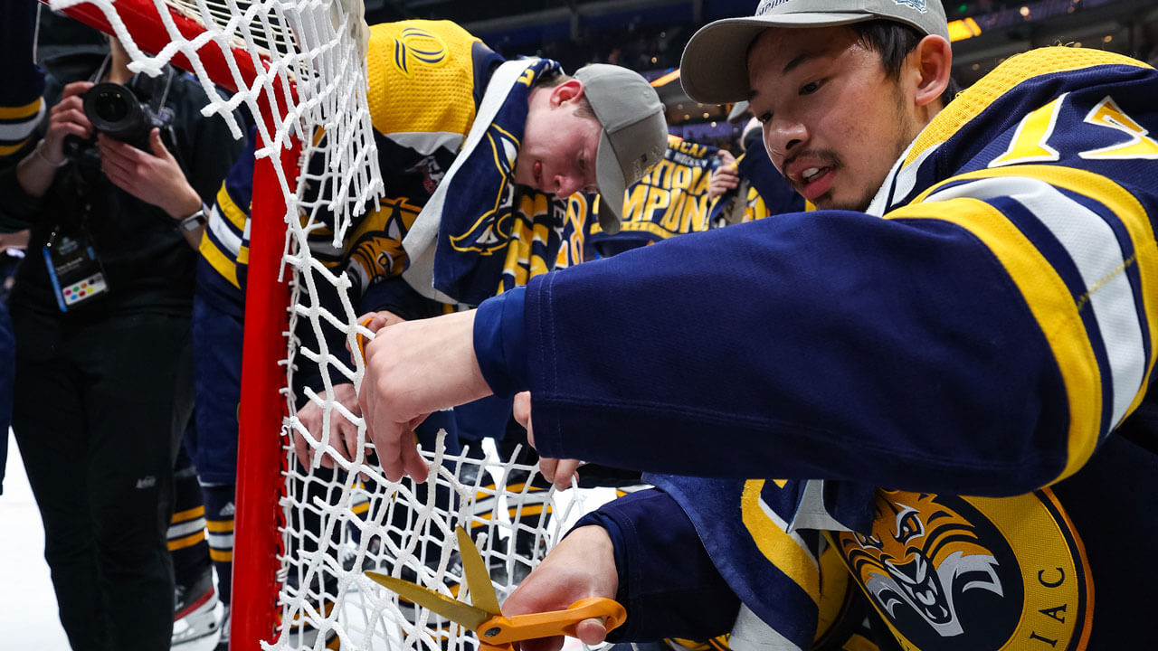 Two teammates cutting goal