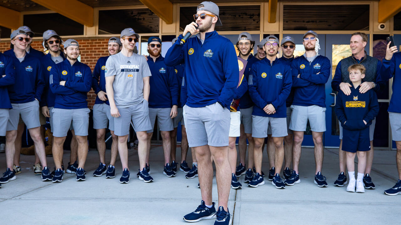 Teammate giving speech to Quinnipiac fans