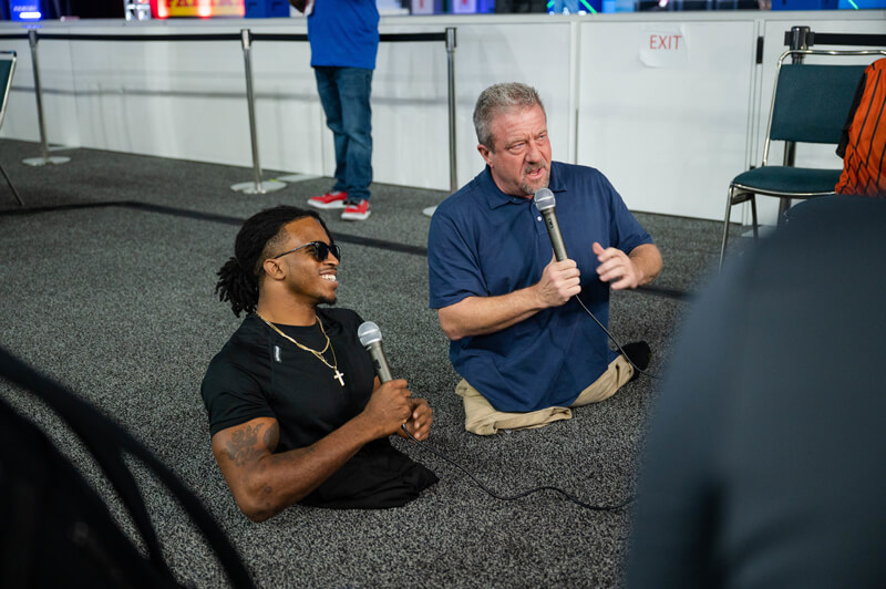 Dave Stevens interviews athlete and social media star Zion Clark in front of cameras