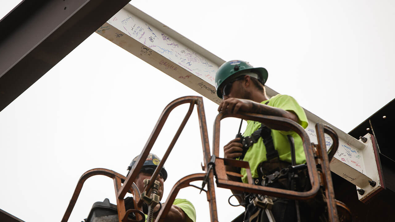 Construction workers talking to one another