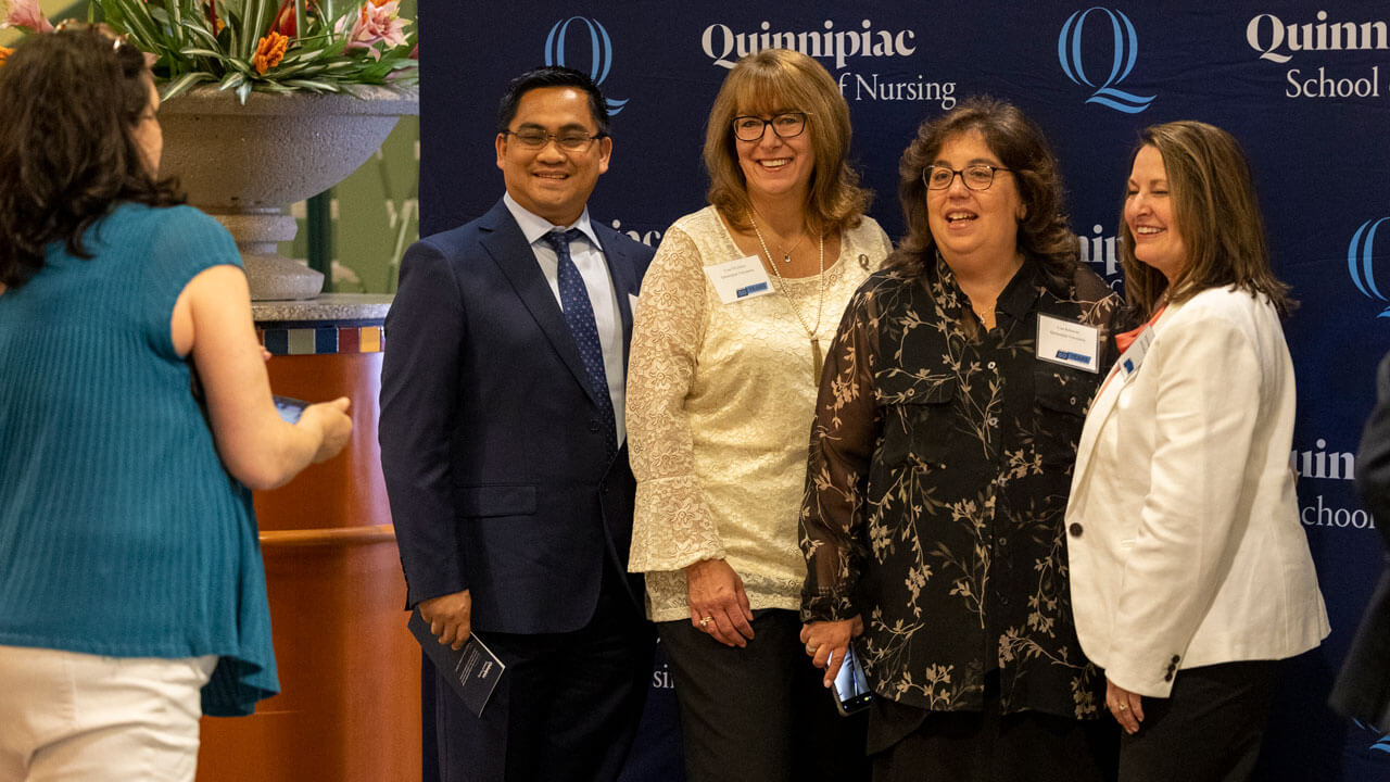 Quinnipiac faculty pose for a photo