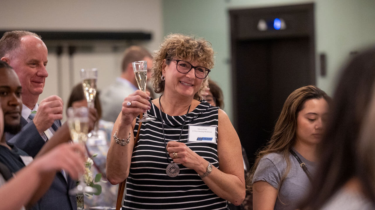 Participants raise a glass