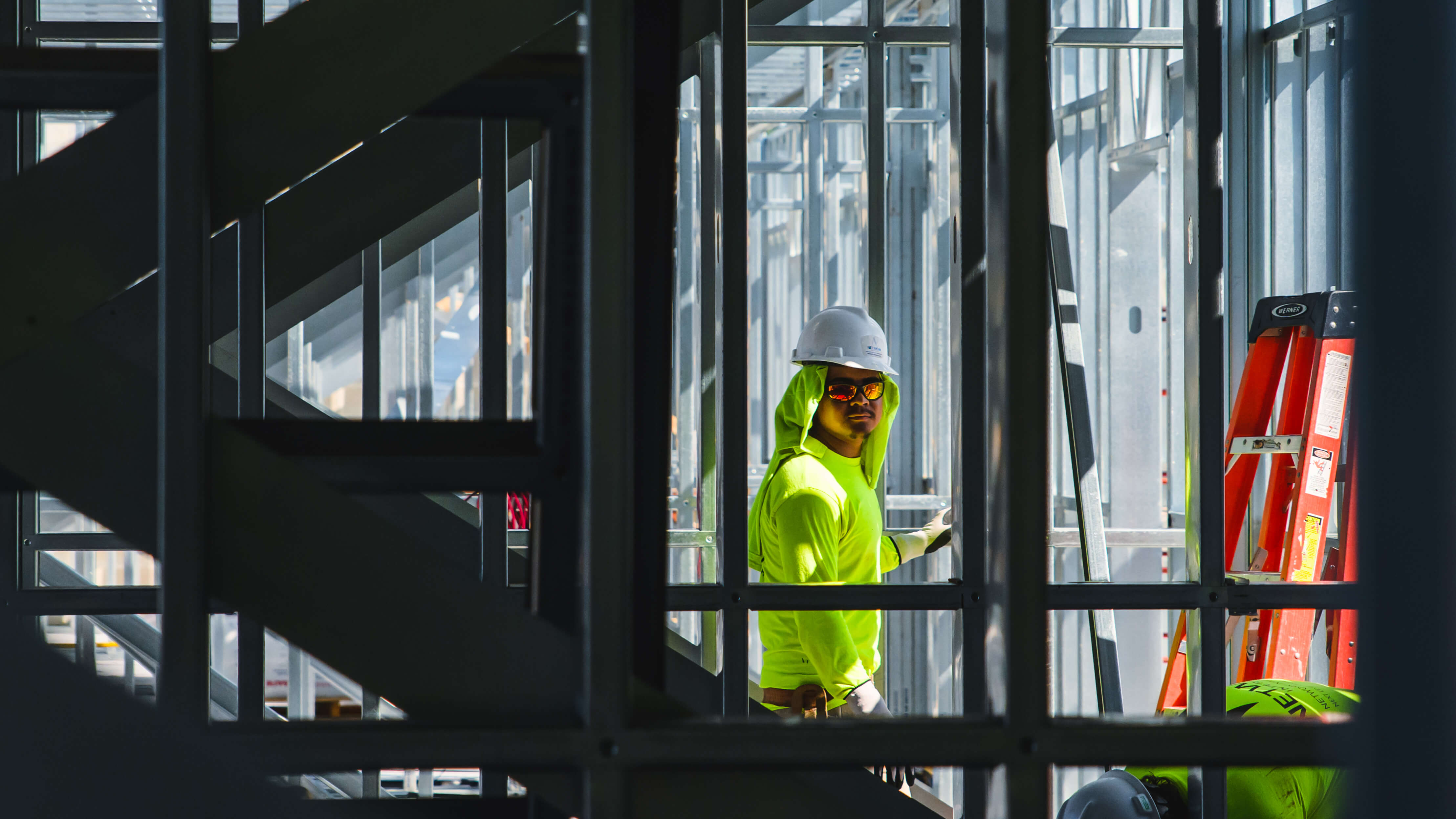 Construction worker locks eyes with the camera