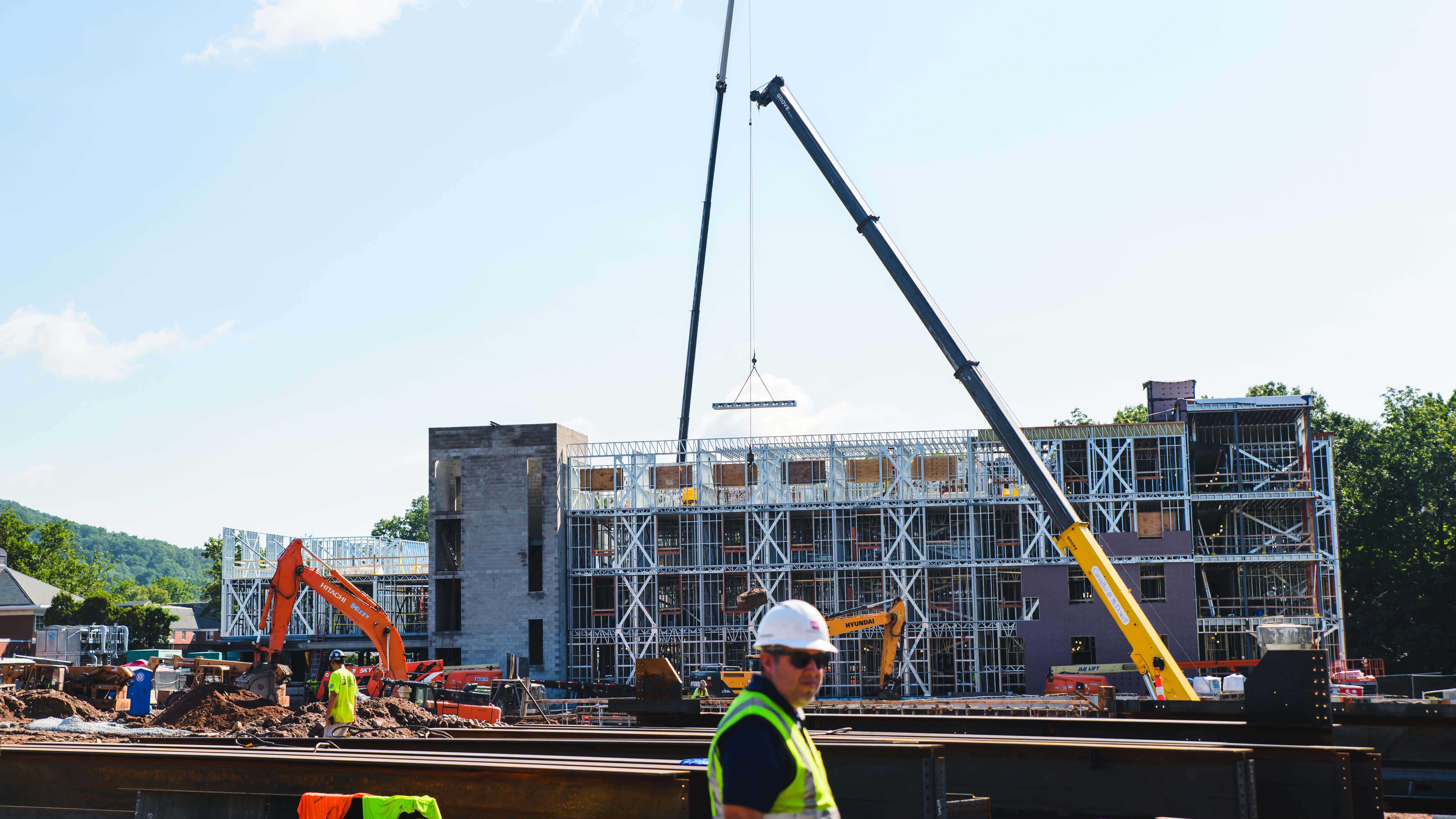 Crane lowers a beam into place