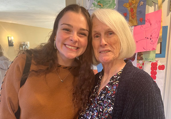 Audrey and her grandmother Patricia Scafati smile together.