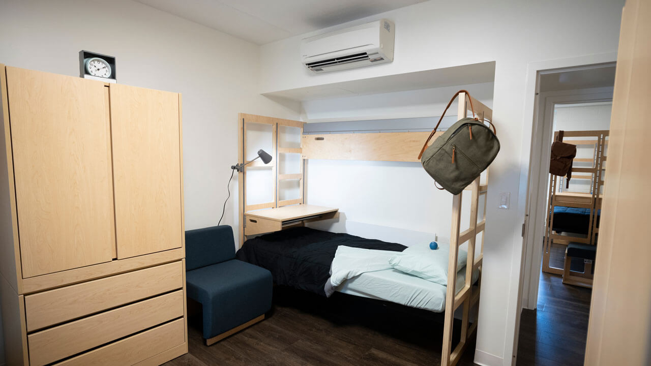 New furniture and air conditioning unit in the Perlroth dorm room