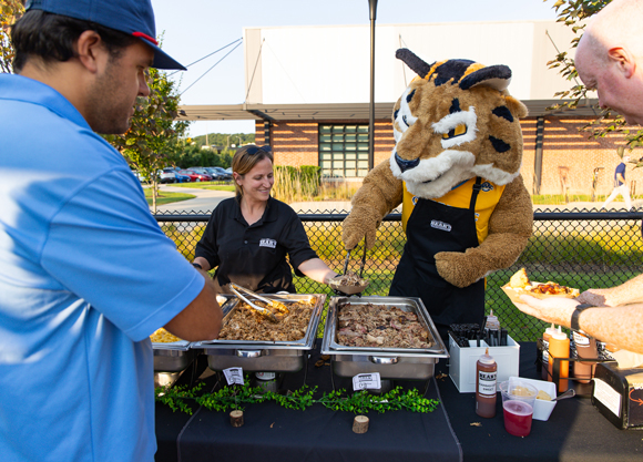 Boomer the mascot serves food