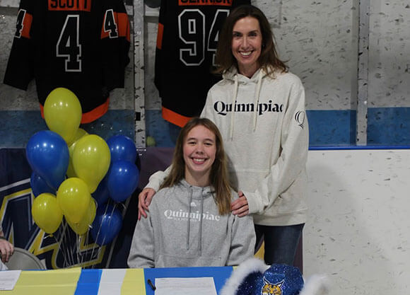 Ella Sennick smiling in Quinnipiac spirit wear