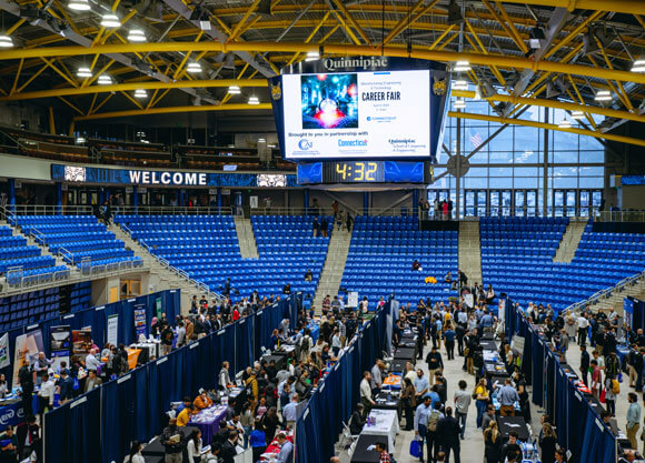 An overhead shot of the M&T Bank Arena filled with tables and people.