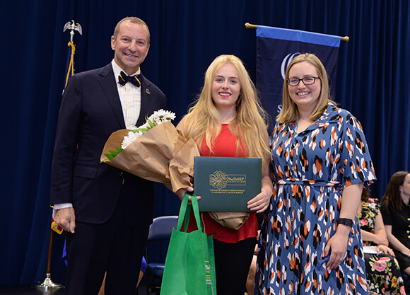 Keira Hines BSN ’25 is awarded a DAISY award from the dean.