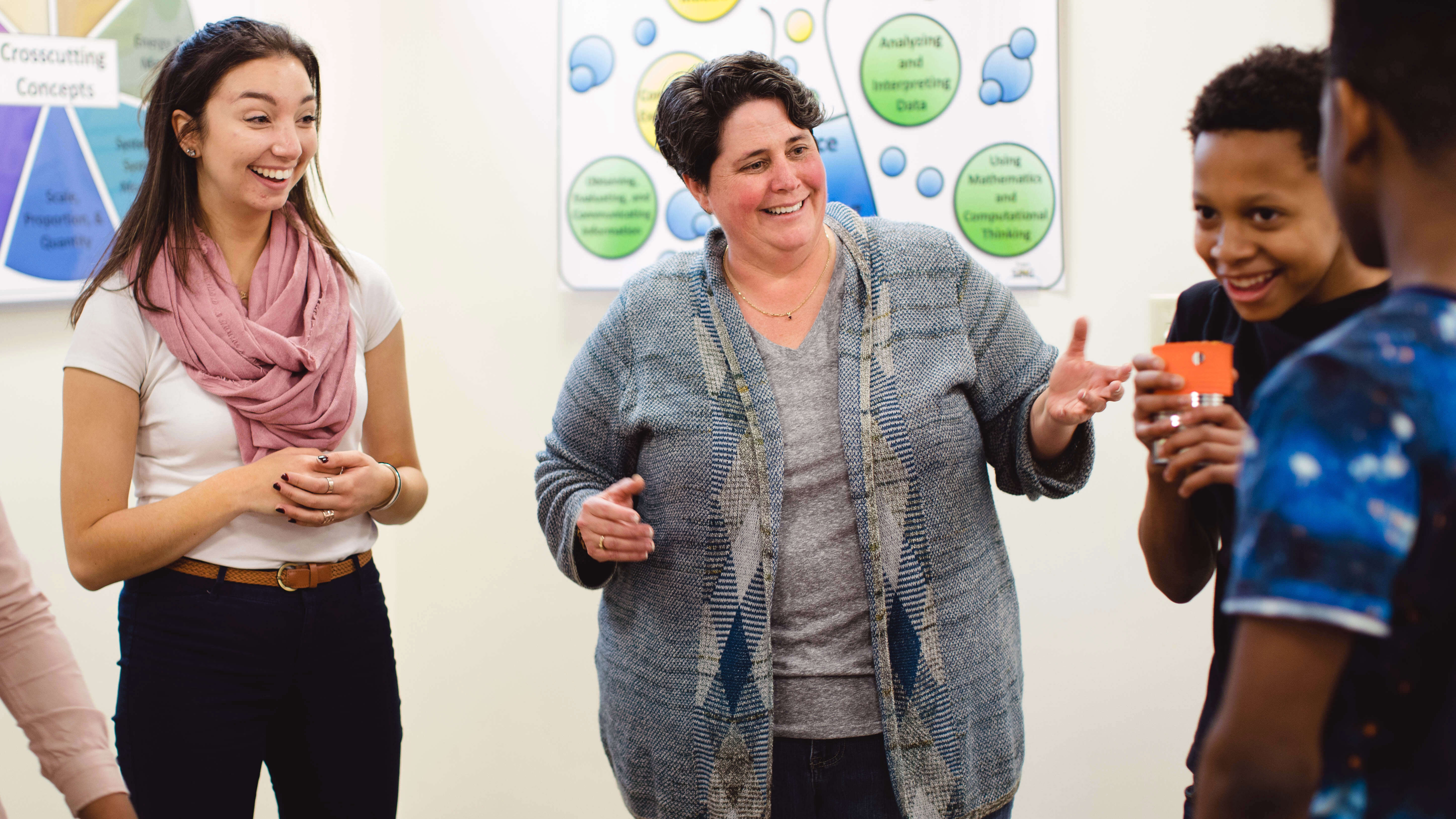 Assistant Teaching Professor Cindy Kern and Amanda Charlton ’20 perform an experiment with students Hakeem Sawyer and Jalen Bradshaw in the School of Education on the North Haven Campus