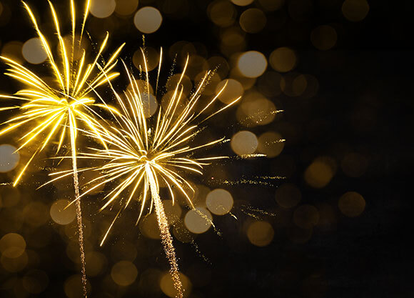 Stock photo of fireworks in a dark sky