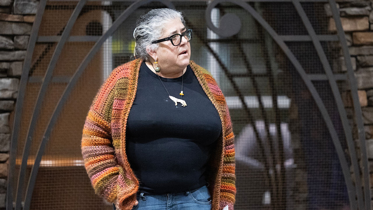 A person participates in a community discussion in the Piazza.