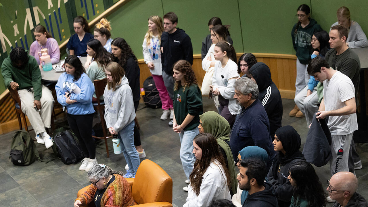 Students participate in a community gathering.