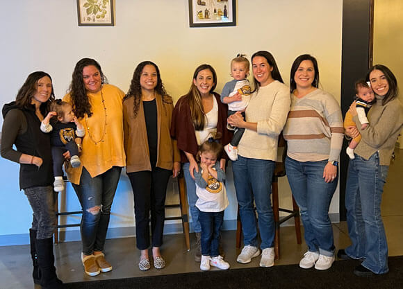 Alumna Ali Warshavsky is pictured with her Bobcat friends and their children.