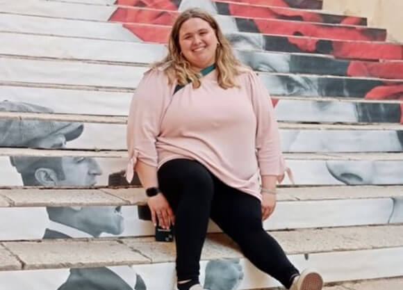 Crystal Lentz sits on a stadium bench