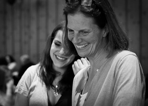 Professor Hudd smiling with a girl in black and white photo