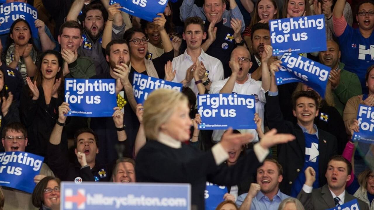 Quinnipiac students and professor cheer behind Hillary Clinton during New Hampshire primary