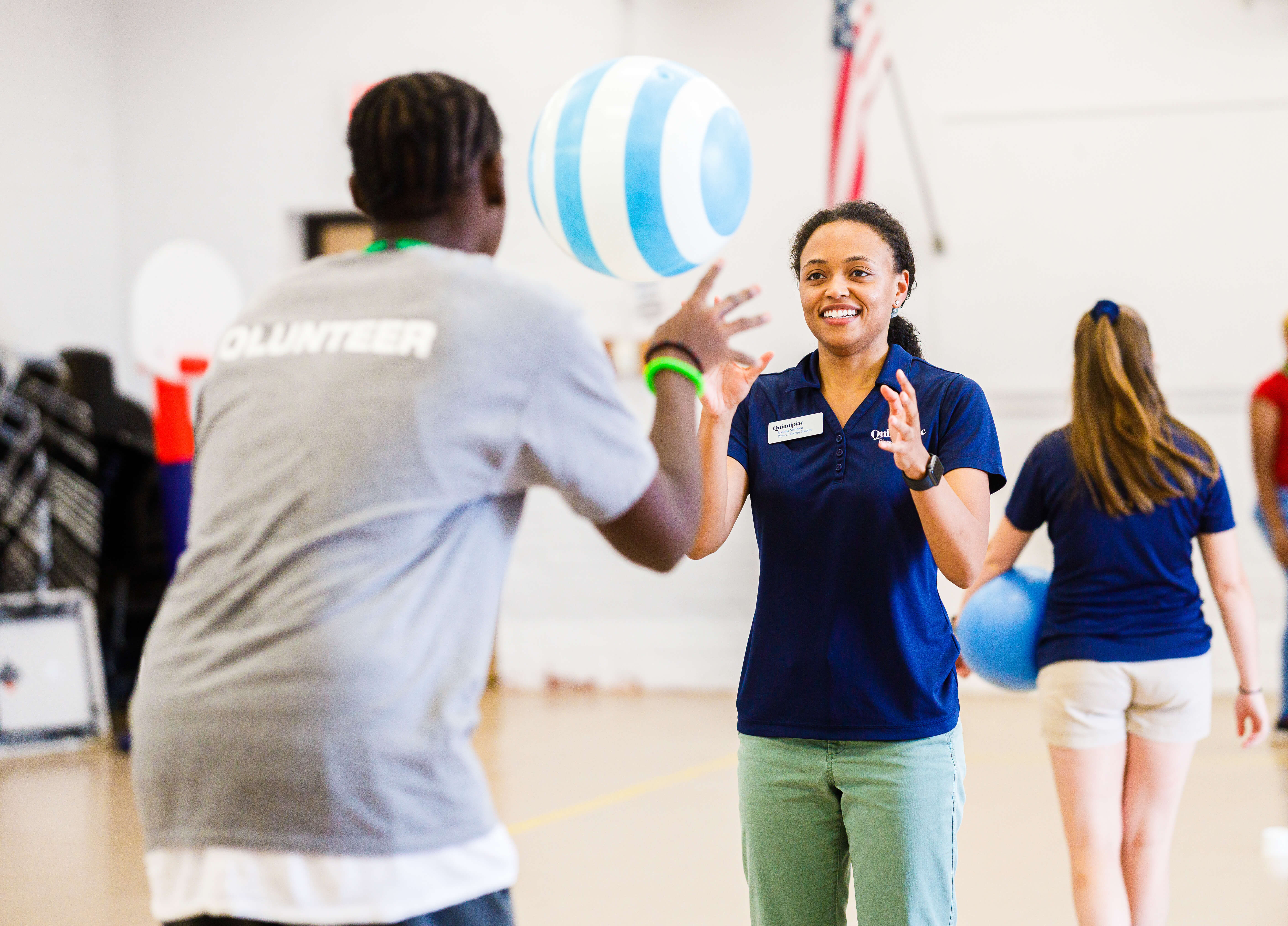 Quinnipiac physical therapy students show local teens some of the exercises they might do with patients someday