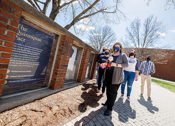 Lisa Cuchara walking with students