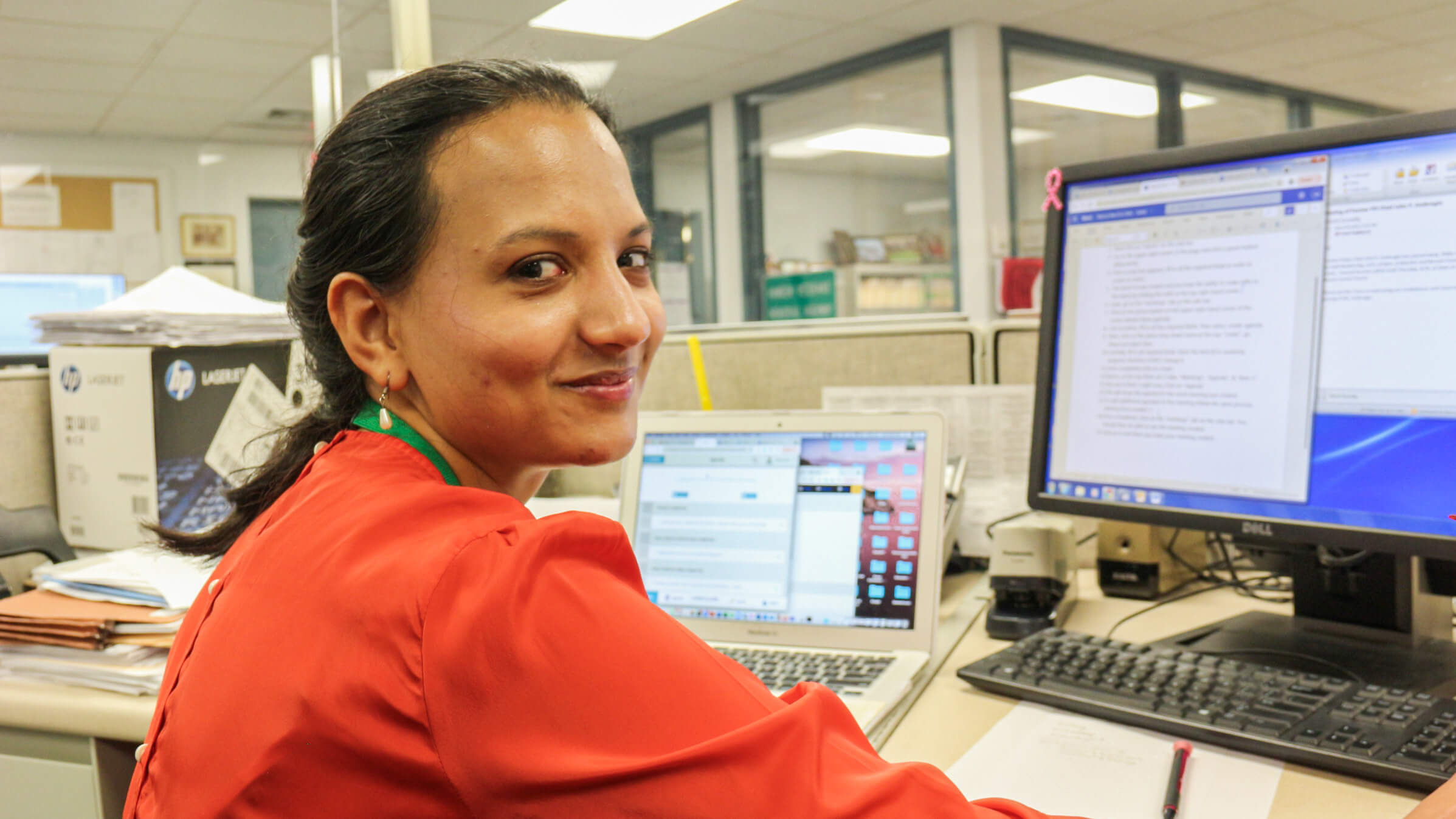 Public Service Fellow Manavi Jain at her desk in the Town Clerk Office in Hamden