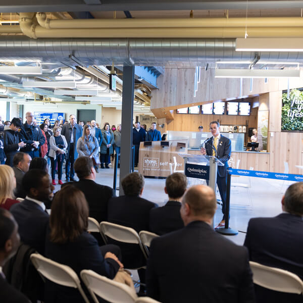 Tom Ellett addresses hundreds of people during the RecWell Grand Opening