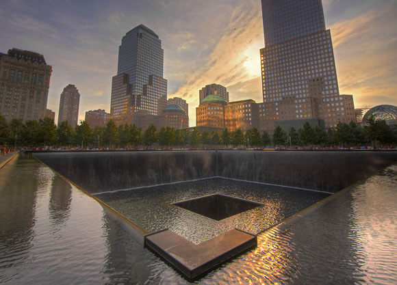 The reflecting pool and skyline of NY at the 9/11 memorial