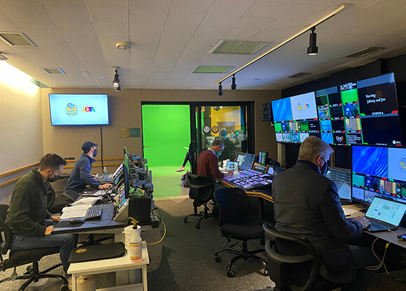 Students work in a control room.