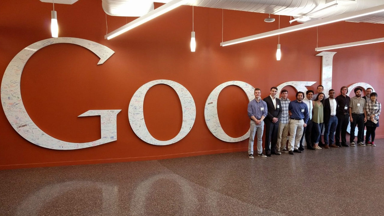 School of Engineering students standing in front of the Google sign